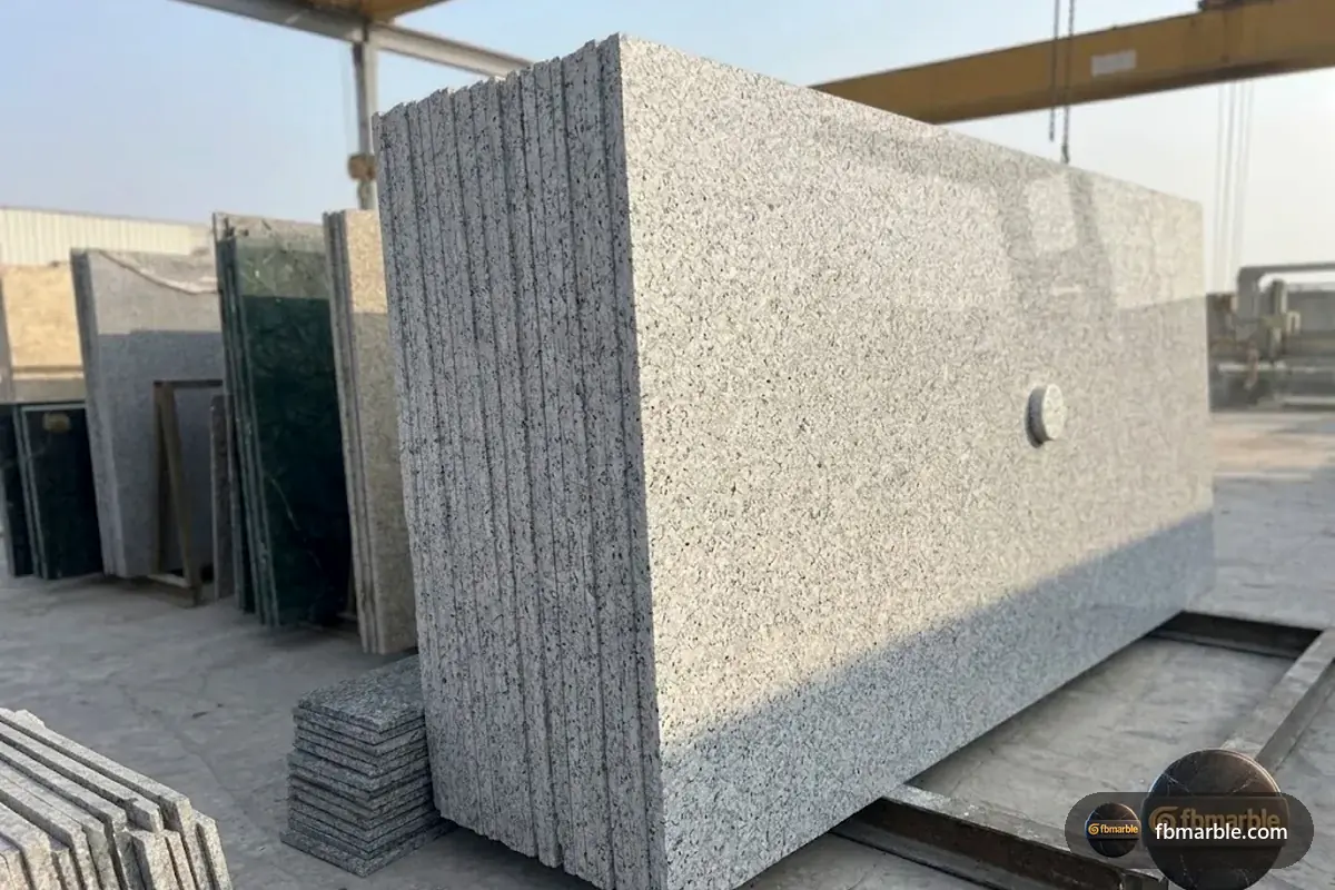 Deer White Granite slab from FB Marble Lahore, suited to white cabinets + grey granite