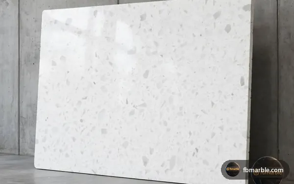 Ice White Quartz slab from FB Marble Lahore, suited to styled quartz counter with plant and fruit bowl