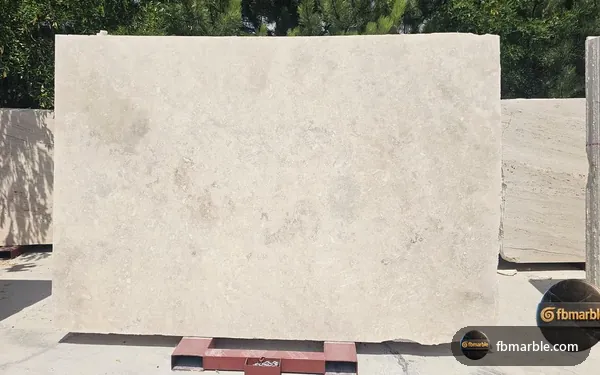 White Travertine slab from FB Marble Lahore, suited to white kitchen cabinets with stone counters