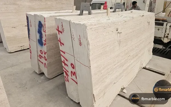 Cream Travertine slab from FB Marble Lahore, suited to island overhang with stools