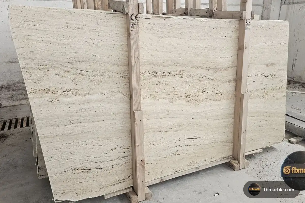 Ivory Travertine slab from FB Marble Lahore, suited to u-shaped kitchen with peninsula