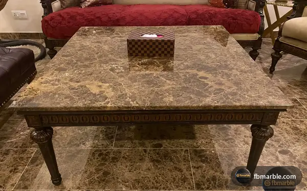 Light Empradore Granite slab from FB Marble Lahore, suited to vinegar bottle crossed out next to granite counter